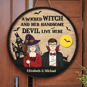 A Wicked Witch And Her Handsome Devil Live Here - Couple Personalized Custom Round Shaped Home Decor Witch Wood Sign - Halloween Gift For Witches, Husband Wife